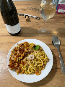 a bottle of tiko estate sits next to a plate of food