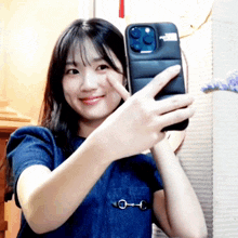 a woman is taking a picture of herself with her phone in a case that says power on it