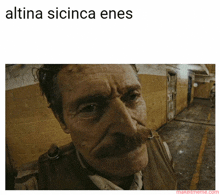 a picture of a man with a mustache and the words " altina sicinca enes " below him