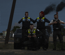 a group of police officers pose for a picture in front of a car