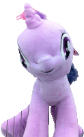 a purple my little pony stuffed animal with a pink mane and tail