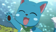 a blue cat with a green scarf around its neck is smiling and waving its paw