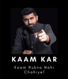 a man is pointing at the camera with the words kaan kar