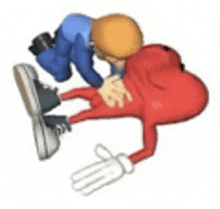 a cartoon character is laying on the ground with a man kneeling over him .