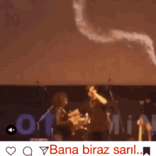 a video of a man playing a trumpet with the words bana biraz saril