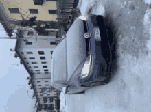 a blue volkswagen car is parked in the snow with a license plate that says tk - 912