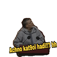 a man sitting at a podium with the words " achno kat9ol hadi ? hh " on it