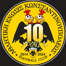 a logo for the aek football club with two chickens and the number 10