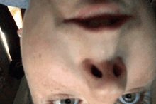 a close up of a person 's face with their eyes closed