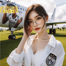 a woman wearing glasses stands in front of a plane that says museum bola on it