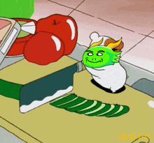 a cartoon character with a green head is cutting a cucumber