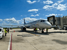 an american airlines connect airplane sits on the runway