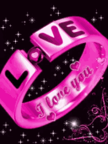 a pink ring that says love on it