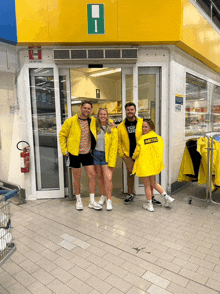 a group of people wearing yellow metro jackets