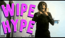 a man is standing in front of a door with the words wipe hype written on it