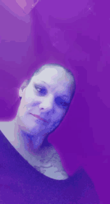 a woman 's face is against a purple background with hearts