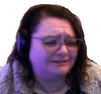 a woman wearing headphones and glasses is crying and making a sad face .