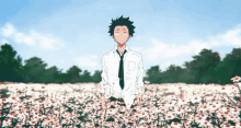 a man in a white shirt and tie stands in a field of daisies