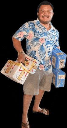 a man in a hawaiian shirt is carrying three boxes of mcdonkey beer