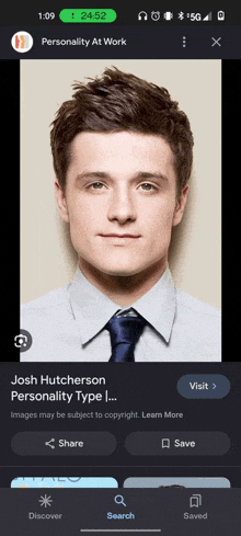 a phone screen shows a picture of josh hutcherson 's personality type