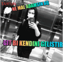 a person taking a picture of themselves in an elevator with the name tayfun on the bottom