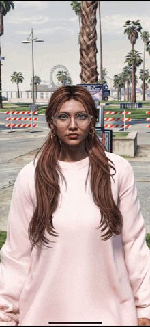 a woman wearing glasses and a pink sweater stands in front of a ferris wheel