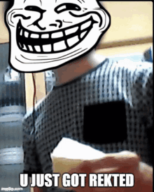 a troll face with the words u just got rekted