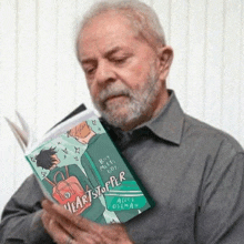 a man reading a book called heartstopper by alice oselman