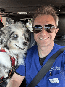 a man wearing sunglasses and a blue scrub top with the name frederick poage on it