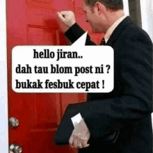 a man in a suit is knocking on a red door with a speech bubble saying hello jiran .