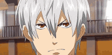 a close up of a person with white hair and red eyes making a funny face .