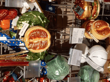 a bunch of christmas ornaments including one that looks like a hamburger and one that looks like an orange