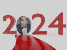 a picture of a man in a tuxedo is surrounded by the number 2024