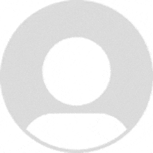 a gray circle with a circle in the middle of it and a person 's face in the middle .