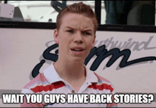 a young man stands in front of a bus that says " wait you guys have back stories "