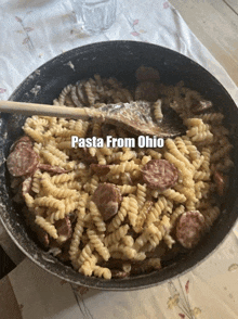 a pan of pasta and sausage with the words pasta from ohio above it