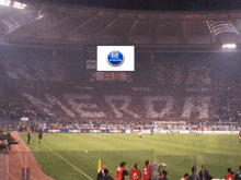 a soccer stadium with a sign that says ' calcio in terza divisione ' on it