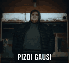 a man in a hooded jacket stands in front of a building with the words pizdi gausi on the bottom