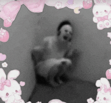 a black and white photo with a pink bunny frame