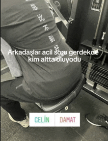 a black and white photo of a person in a gym with the words gelin and damar on the bottom right