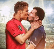 a couple of soccer players are kissing each other on a field .