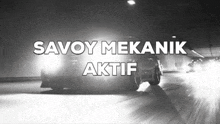 a black and white photo of a car with the words savoy mekanik aktif