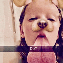 a girl wearing a fake dog nose has her tongue out