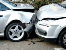 two cars are involved in a car accident and one is damaged .