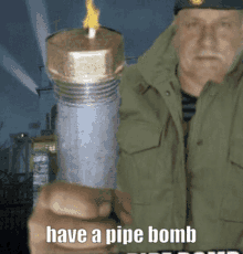 a man in a green jacket holding a pipe bomb