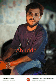 a picture of a man with the name abuddd on the bottom right