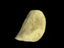 a slice of potato chips on a black background .