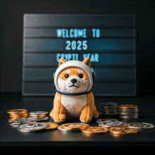 a stuffed dog wearing a space helmet sits in front of a sign that says welcome to 2025