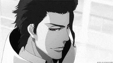 a black and white photo of a man with long hair in a bleach anime .