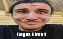 a man making a funny face with the words bogos binted written below him